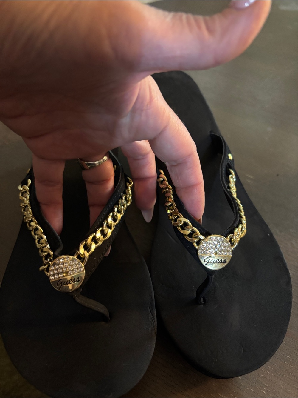 Guess Black Flip Flop Sandals with Gold Chain & Crystal Medallion Accents